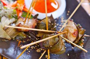 bite-sized pieces of boneless chicken cooked in parcels of pandamas leaves